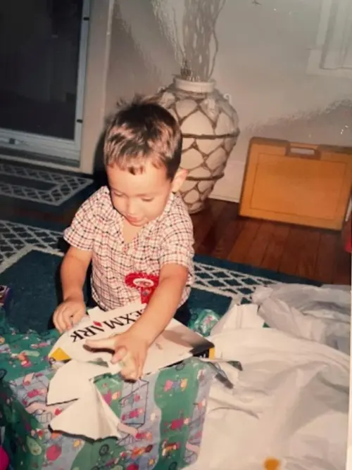 Four-year-old Zack unwrapping a Lexmark printer